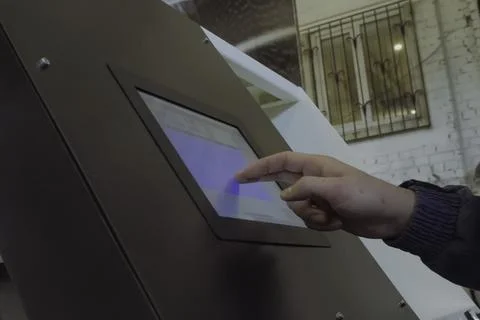 Touch control panel of equipment, tapping your finger on the touch panel. Stock Photos