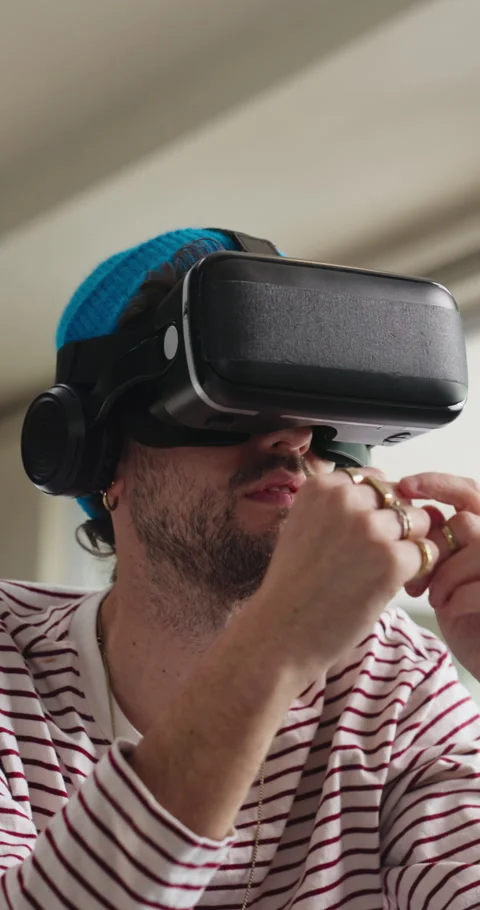 Touch, home and man with virtual reality glasses for cyberspace, metaverse and Stock Footage 333199145