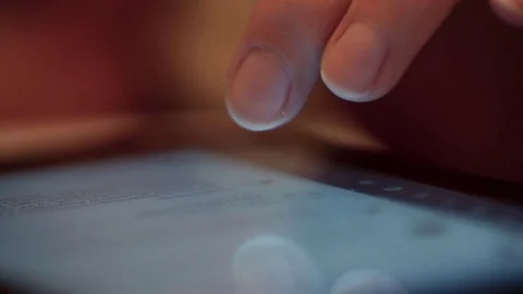 The touch screen and your fingers flipping the text Stock-Footage 72525478