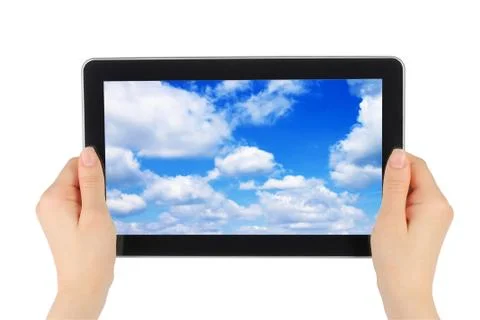 Touch screen device with blue sky in woman hands Stock Photos