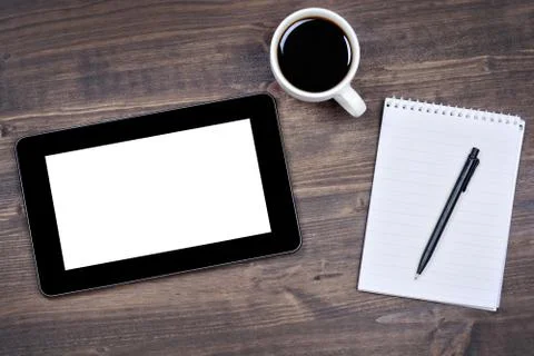 Touch screen device, notepad, pen and cup of coffee Stock Photos
