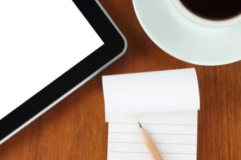 Touch screen device, notepad, pencil and cup of coffee Stock Photos