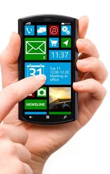 Touch screen smartphone hand is holding a touch screen smartphone with mob... 库存照片