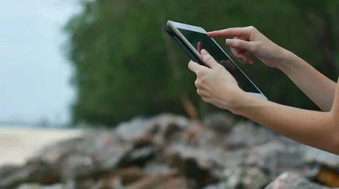 Touch Screen Tablet On Rock At Beach Stock Footage 51665641