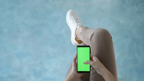 Touch screen for watching app, home leisure using cell phone for web surfing pov Stock Footage 125610965