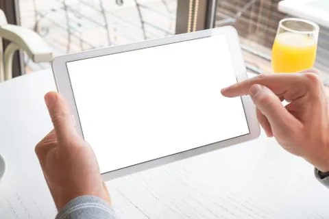 Touch tablet with right hand. Tablet with isolated screen for mockup. Horizon Stock Photos