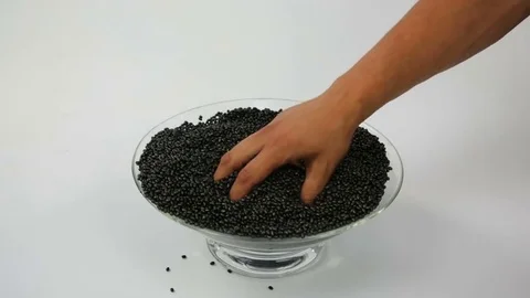 Touching Black Grain Polymer Stock Footage 69166854