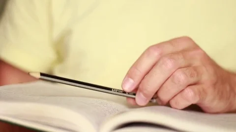 Touching a book with pencil 動画素材 75026001