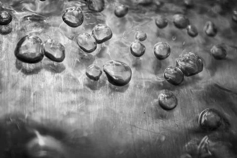 Touching Bubbles in Water on Metal Stock Photos