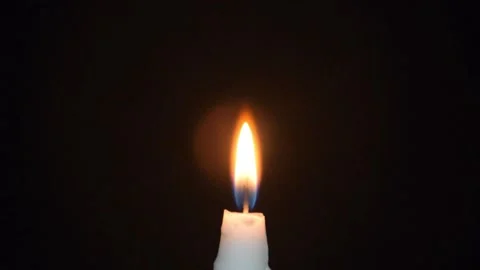 Touching the Fire on Candle Stock Footage 153213789