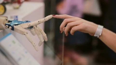 Touching hands of human and cyborg or The Creation of cyborg 스톡 동영상 72598748