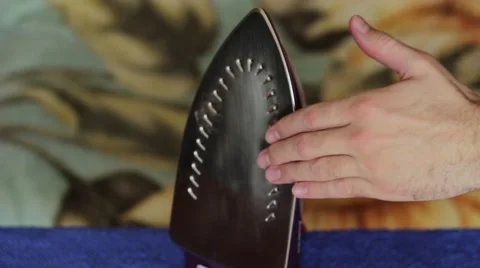 Touching a hot iron Stock Footage 66754149