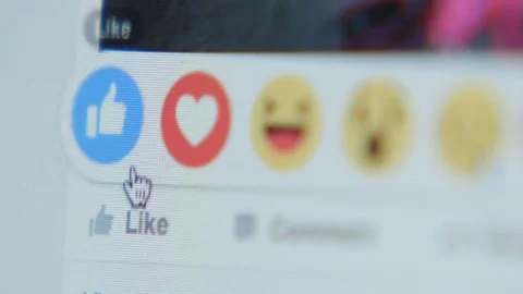 Touching to the icon (Like) in Facebook - close up, side Stock Footage 70155479