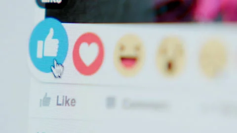 Touching to the icon (Like) in Facebook - close up, side Stock Footage 144417767