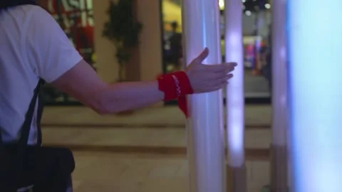 Touching laps. Man traveler touching colorful lamps. Tourist in Asia. Stock Footage 150665476