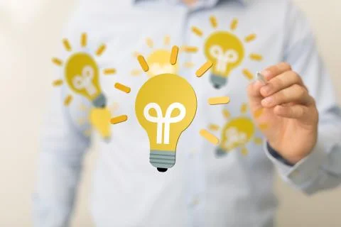 A  touching light bulbs, new ideas with innovative technology and creativity. Stock Photos
