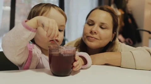 A touching moment between mother and child as a mother and her daughter happily Stock Footage 311247645