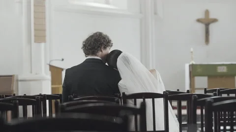 Touching moment at the wedding ceremony. Action. Rear view of a bride in white Stock Footage 201820128