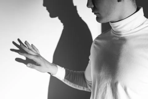 Touching my own shadow Foto stock