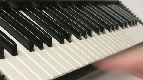 Touching piano keyboard Stock Footage 561843