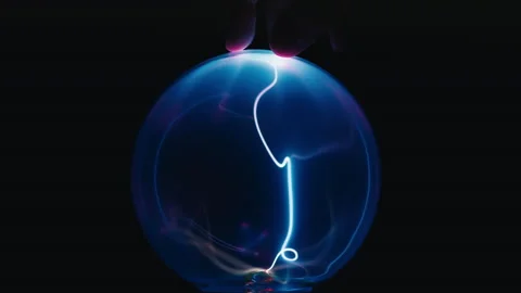 Touching Plasma Ball on black background Stock Footage 196723830