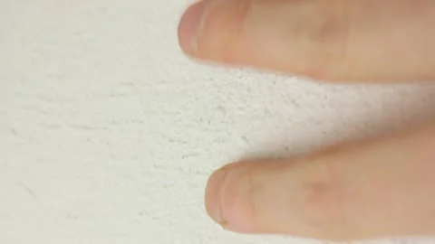 Touching the plastered wall with hands close-up. 스톡 동영상 172460455