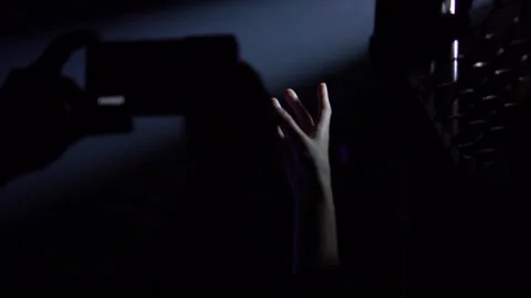 Touching the projector light beam Video stock 144437658