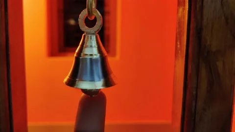 Touching small bell with human finger Stock Footage 145680578