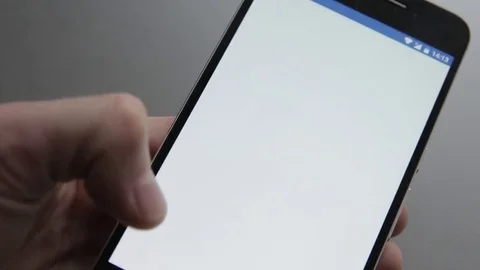 Touching a smartphone with a touch screen to scroll on contact list Stock Footage 70141209
