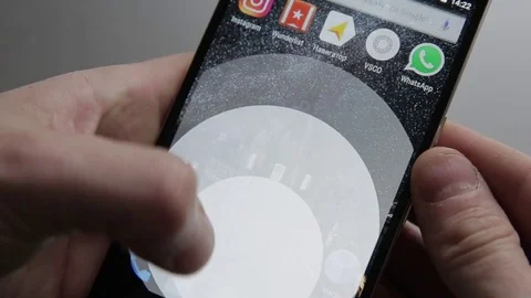 Touching a smartphone with a touch screen to tern on google disk application Stock Footage 70141235