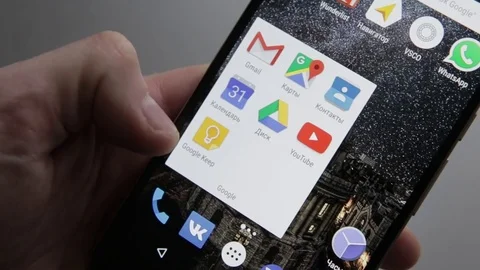 Touching a smartphone with a touch screen to tern on google calendar application Stock Footage 70141236