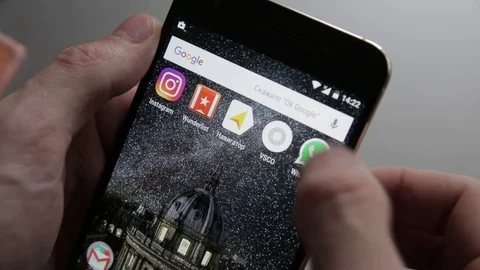 Touching a smartphone with a touch screen to tern on whatsapp aplication Stock Footage 70141246