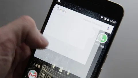 Touching a smartphone with a touch screen to tern on of instagram application Stock Footage 70141533