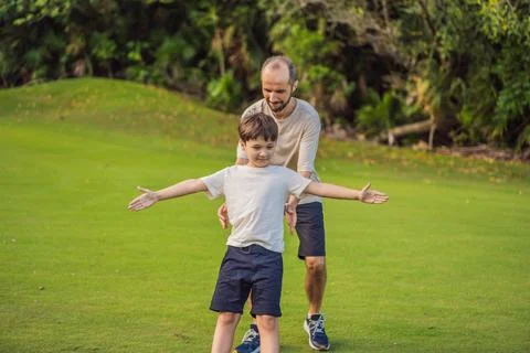 A touching trust exercise as a son falls back into his father's arms Stock-Fotos