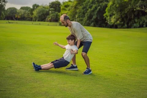 A touching trust exercise as a son falls back into his father's arms Stock-Fotos