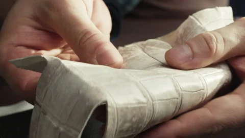 Touching white snake leather with hand close-up, production handmade accessories Stock Footage 157076063