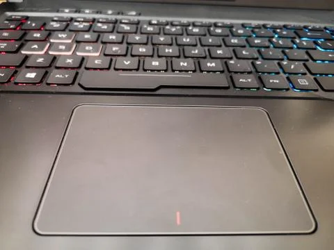Touchpad in a laptop, large, comfortable touchpad. Close up hands of unrecogn Stockfoto's