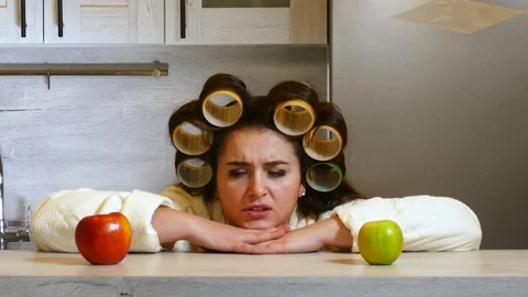 Tough choice between red and green apples for plus size girl. Good idea concept. Stock Footage 124001284