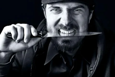 Tough guy with knife Stock Photos