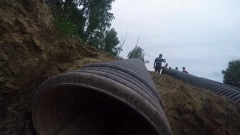 Tough Guy Race, lifting the pipe up Stock Footage 127708246