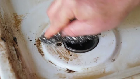 Tough Scrubbing: Deep Cleaning an Old Gas Stove in a Messy Kitchen Stock Footage 274582916