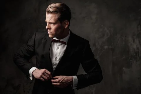 Tough sharp dressed man in black suit Stock Photos