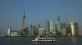 Tour Boat Passing in front of Shanghai Skyline Pudong City Landmarks Sunny Day HD Footage