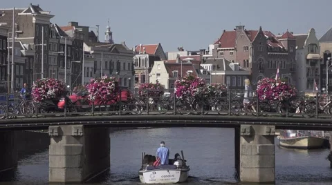 Tour boats on water channel in Amsterdam. 4K Stock Footage