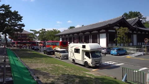 Tour Buses and Tiny Japanese RV Parked at Kofuku-ji Buddhist Temple in Nara Stock Footage 264538586