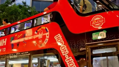 Tour completed, two buses deliver guests back to the starting point in Ho Chi Stock Footage 331078613