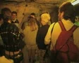 Tour group inside dark room SD Footage