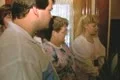 Tour group listening to audio recording during tour Footage
