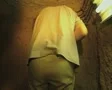 Tour group walking through narrow underground passage SD Footage