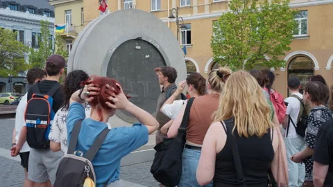 Tour Guide Explaining the Vilnius-Lublin Portal Installation to Tourists Stock Footage 334771815